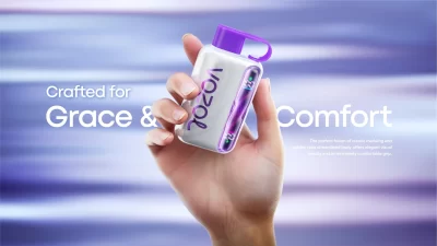 Close-up of a hand holding a VOZOL Modular vape device with sleek purple accents, paired with text "Crafted for Grace & Comfort" against a blurred background.